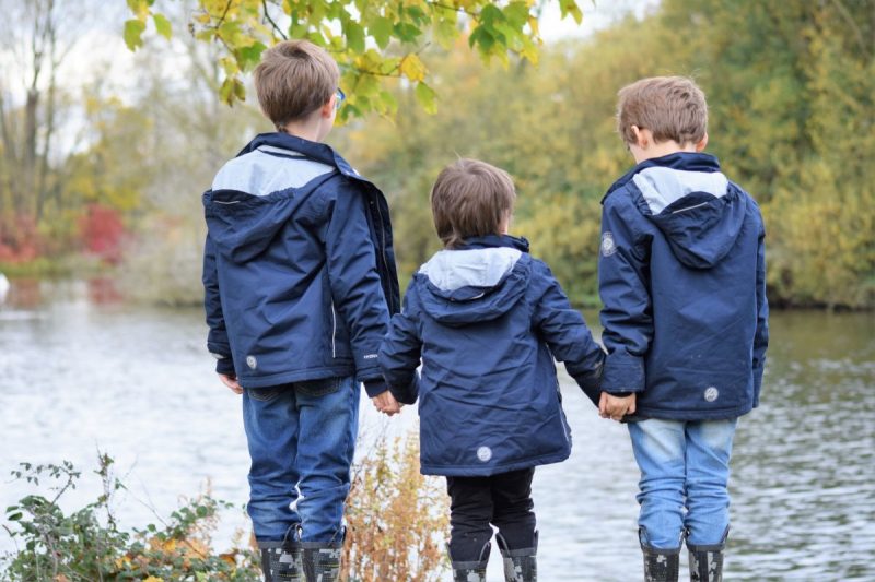 3 boys holding hands