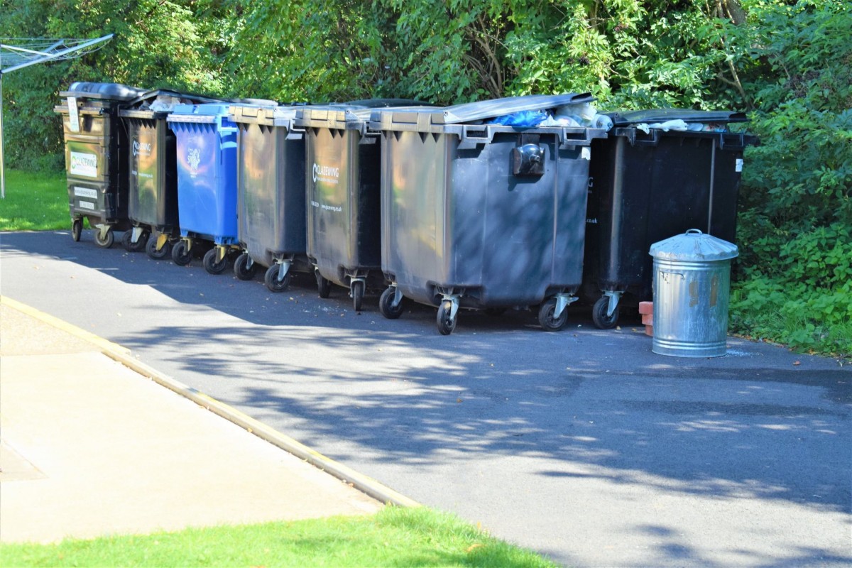 The bins behind the facilities block at Cambridge Camping and Caravanning Club