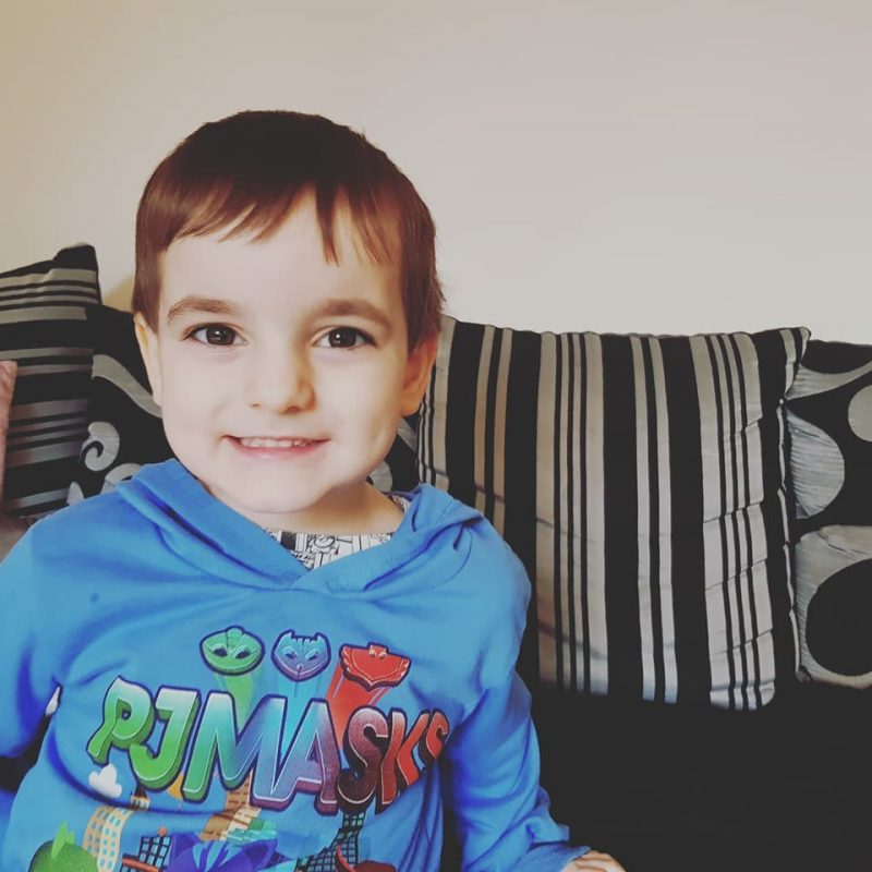 Small boy wearing Pj Masks top