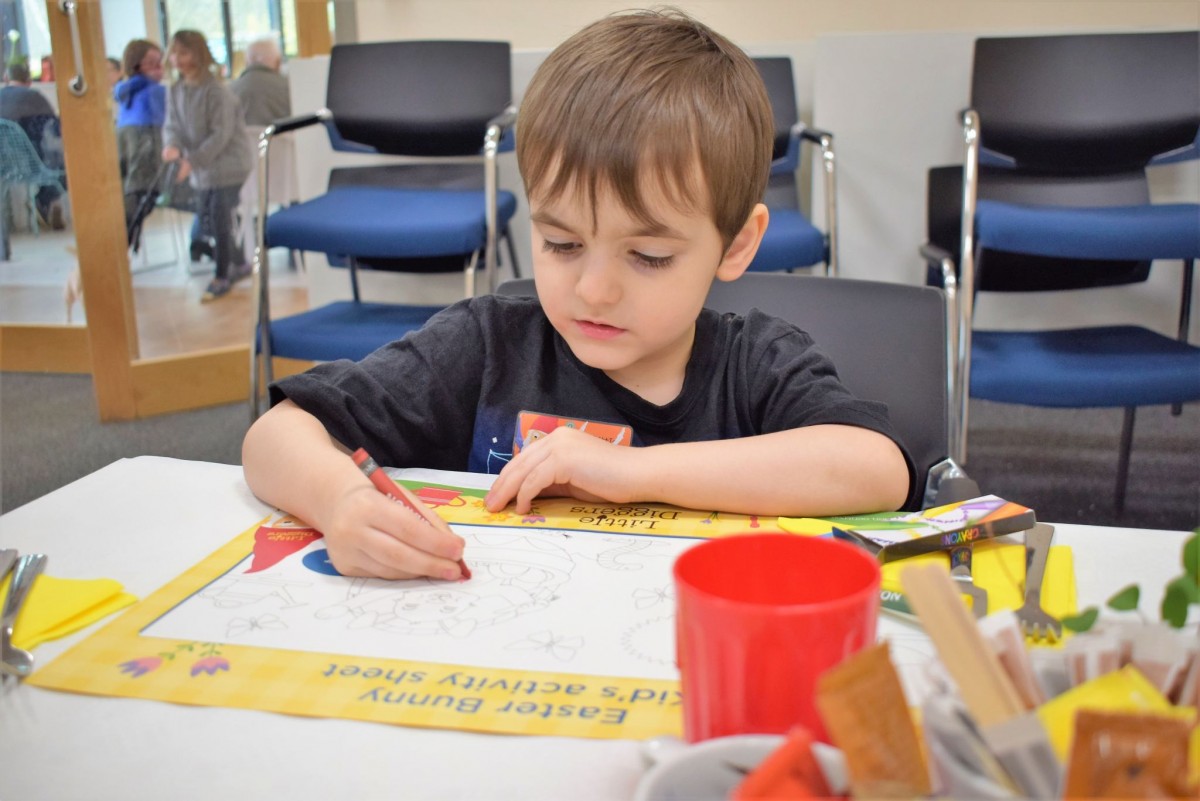 Arthur completing the Easter activity worksheet - Wyevale Garden Centre